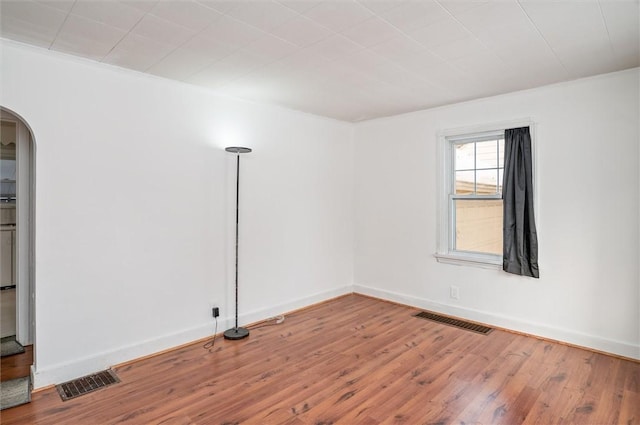 empty room with wood-type flooring