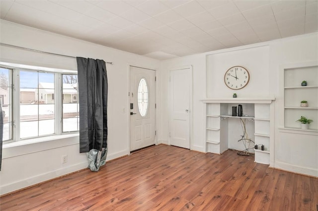 entrance foyer featuring plenty of natural light and hardwood / wood-style floors