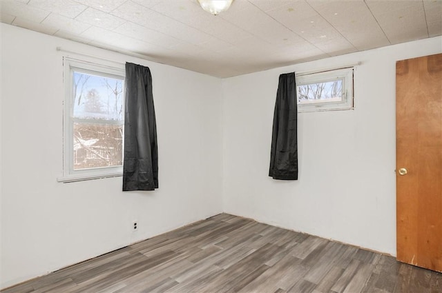 unfurnished room featuring wood-type flooring