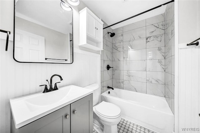 full bathroom with vanity, tiled shower / bath combo, and toilet