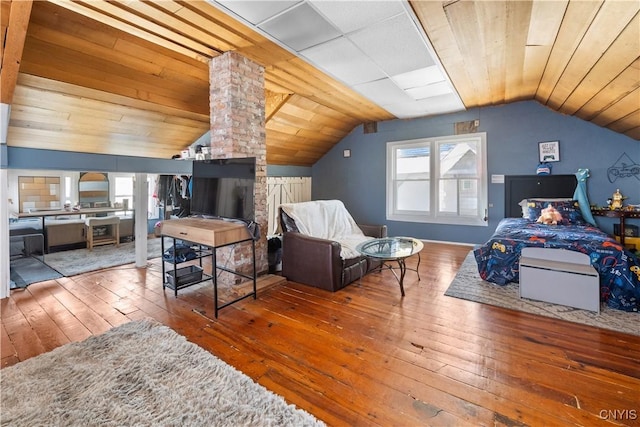 bedroom featuring lofted ceiling, hardwood / wood-style floors, multiple windows, and wooden ceiling