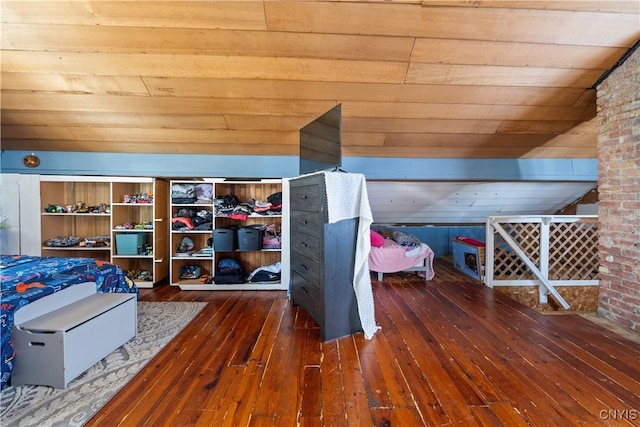 unfurnished bedroom with lofted ceiling, dark hardwood / wood-style floors, and wooden ceiling