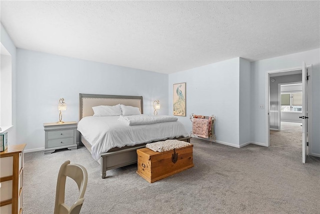 carpeted bedroom with a textured ceiling