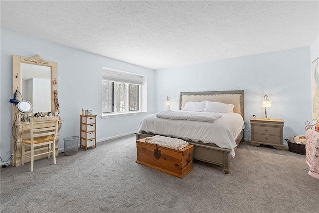 bedroom with carpet and a textured ceiling