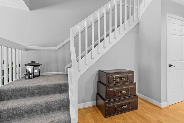 stairway featuring hardwood / wood-style floors