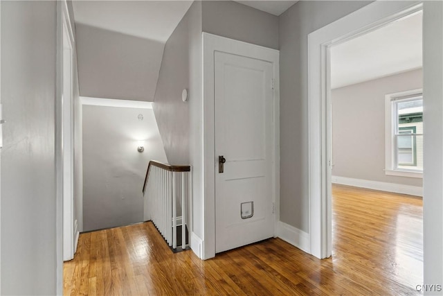 corridor featuring hardwood / wood-style floors