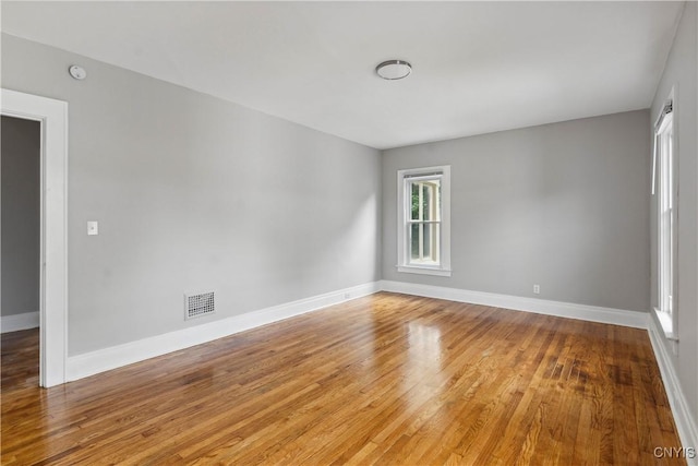 spare room with light hardwood / wood-style flooring