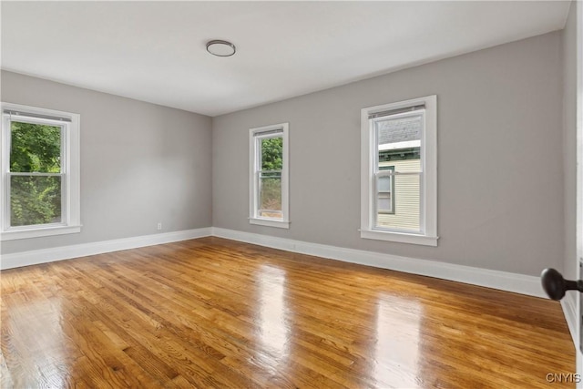 spare room featuring light hardwood / wood-style floors