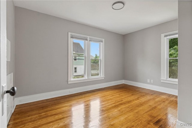 unfurnished room featuring wood-type flooring