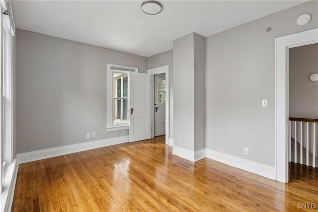 spare room featuring light hardwood / wood-style flooring