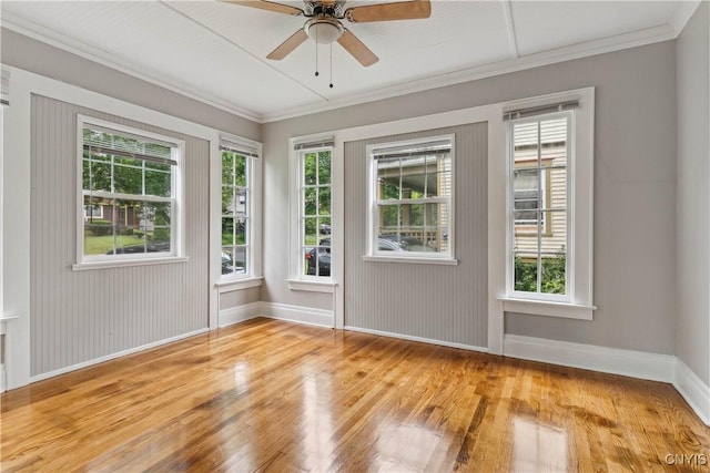 unfurnished room with ceiling fan, a healthy amount of sunlight, and wood-type flooring