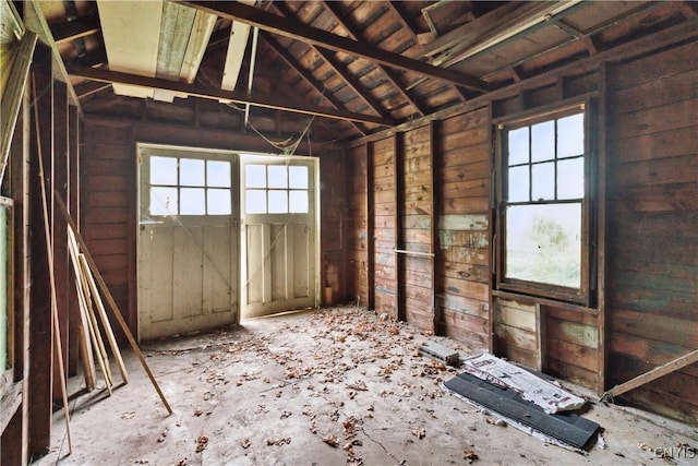 miscellaneous room with lofted ceiling