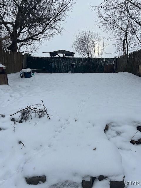 view of yard layered in snow