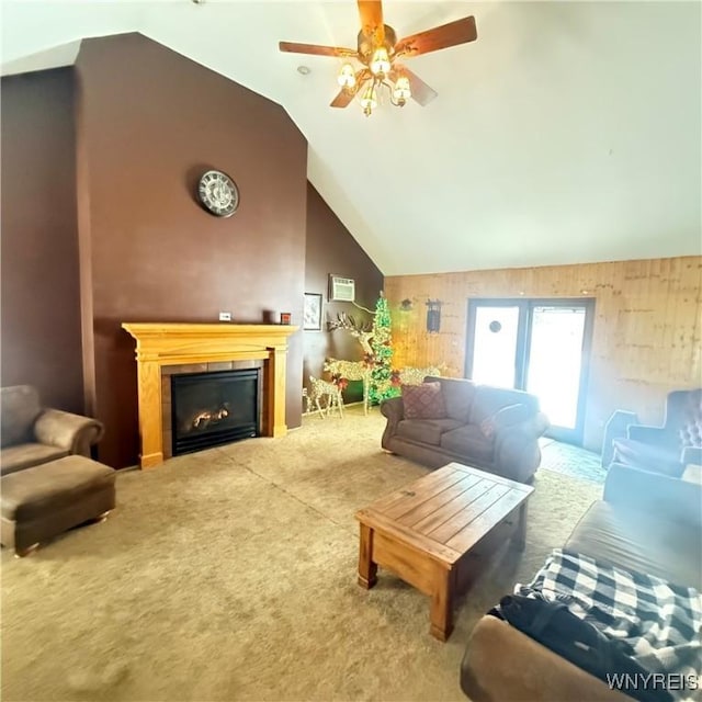 living room with a fireplace, high vaulted ceiling, carpet, and ceiling fan