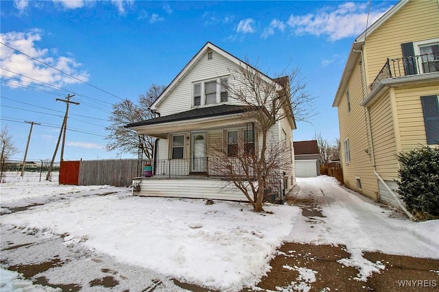 view of front property with a garage and a porch