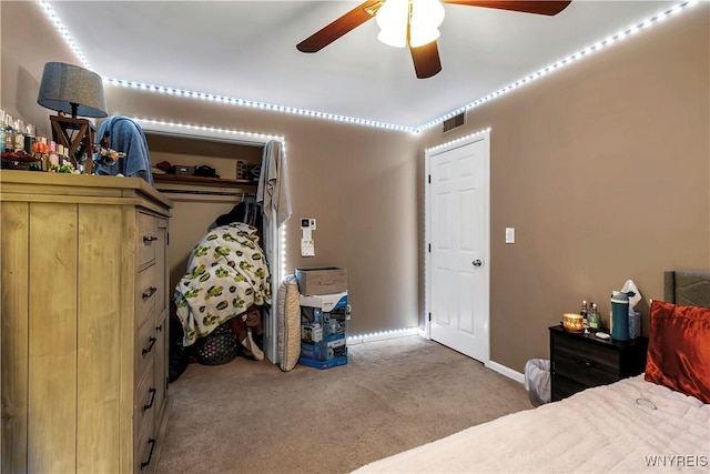 bedroom with ceiling fan, carpet, visible vents, and baseboards