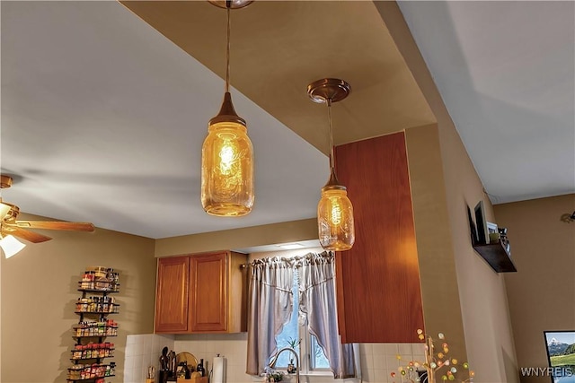 details with tasteful backsplash, a ceiling fan, and brown cabinetry