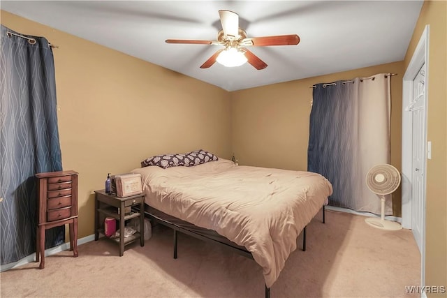 bedroom with light colored carpet and ceiling fan