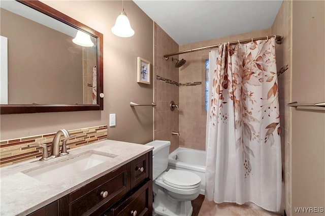 bathroom with vanity, toilet, shower / bathtub combination with curtain, and tasteful backsplash