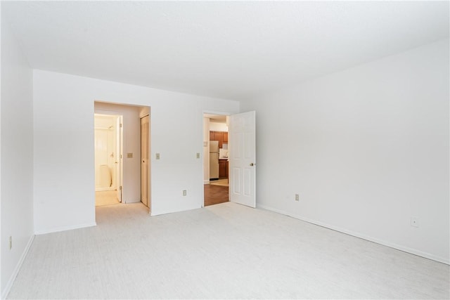 empty room featuring light carpet