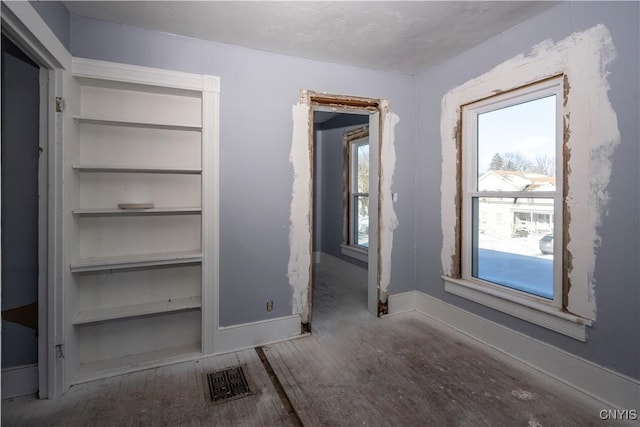 unfurnished bedroom featuring wood-type flooring