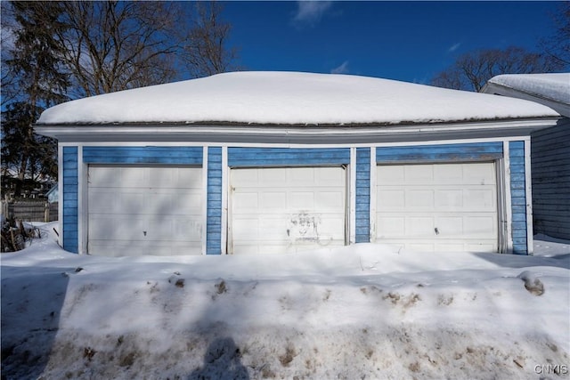 view of snow covered garage