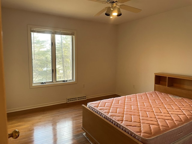 unfurnished bedroom with hardwood / wood-style flooring and ceiling fan