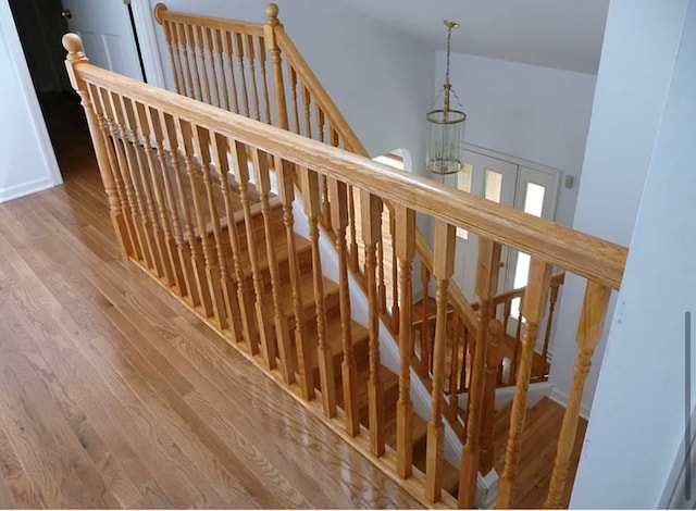 stairway featuring wood-type flooring