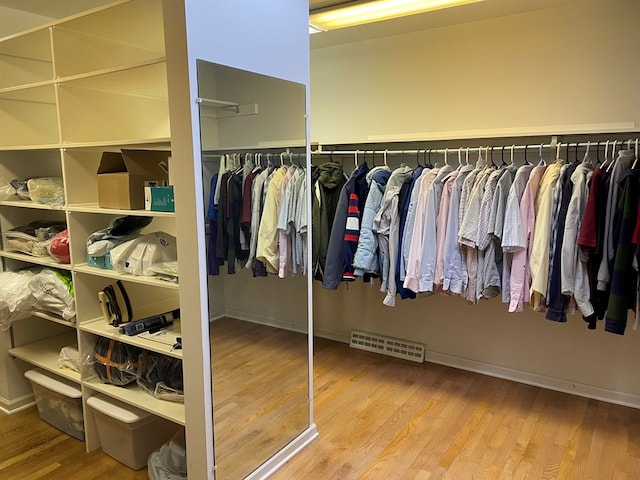 walk in closet featuring hardwood / wood-style floors