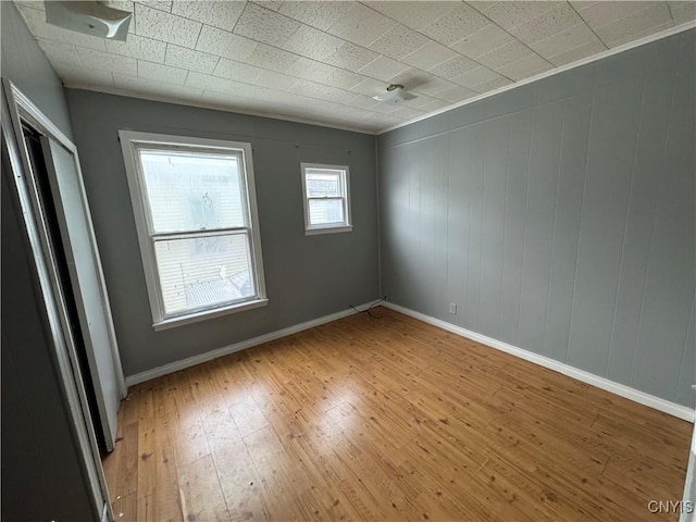 spare room featuring light hardwood / wood-style floors