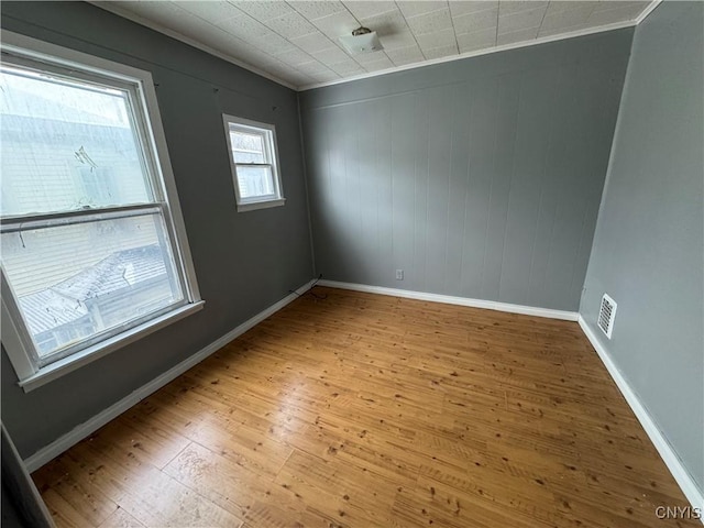 spare room featuring light wood-type flooring