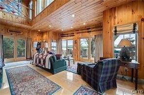 bedroom with wooden ceiling, access to outside, a high ceiling, and wood walls