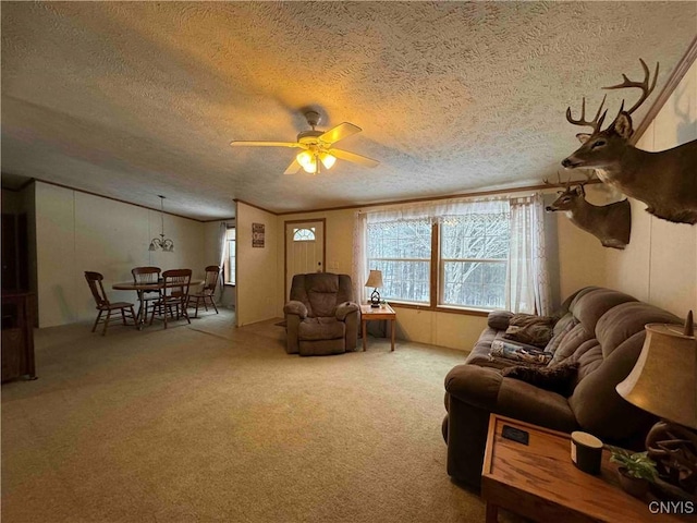 living room featuring lofted ceiling, carpet, a textured ceiling, and ceiling fan