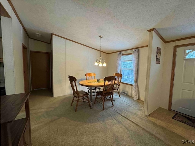 carpeted dining area featuring a notable chandelier, crown molding, and a textured ceiling