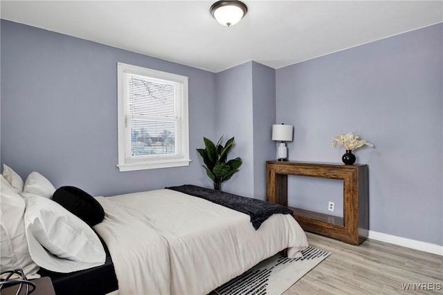 bedroom with light wood-type flooring