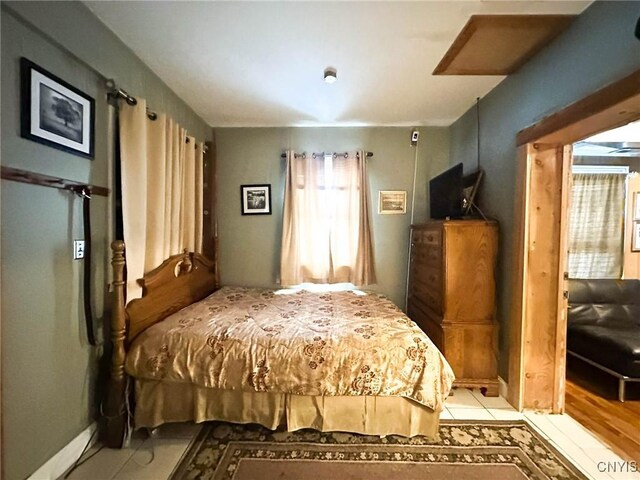 bedroom with light tile patterned flooring