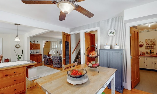 dining space with ceiling fan