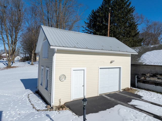 view of snow covered garage