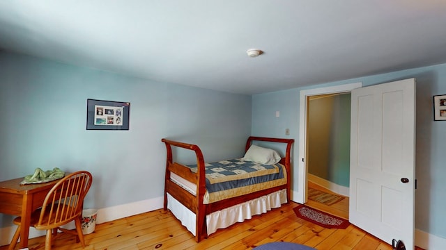 bedroom with light hardwood / wood-style floors