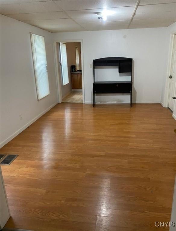 empty room with hardwood / wood-style floors