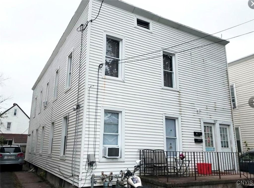 view of front of home with cooling unit