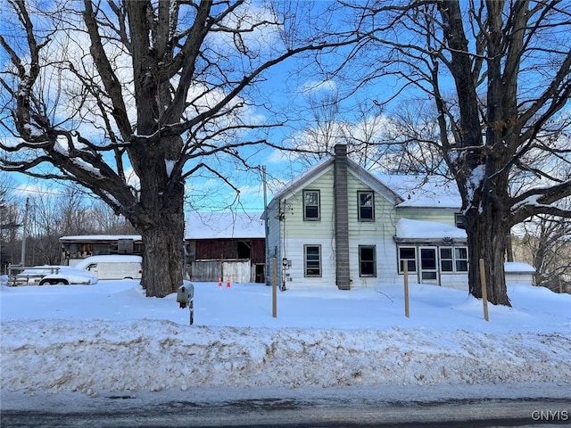 front facade with a sunroom