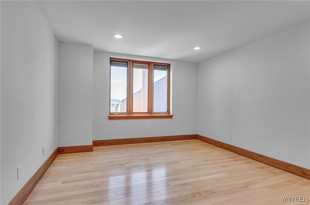 spare room featuring light hardwood / wood-style floors