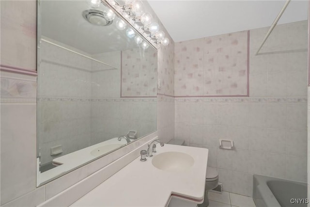 full bathroom with tile walls, vanity, tile patterned floors, and toilet