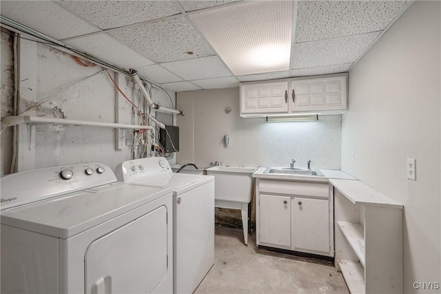 clothes washing area with sink and washing machine and clothes dryer