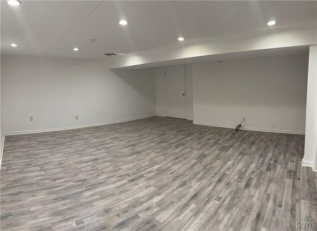 basement featuring hardwood / wood-style flooring