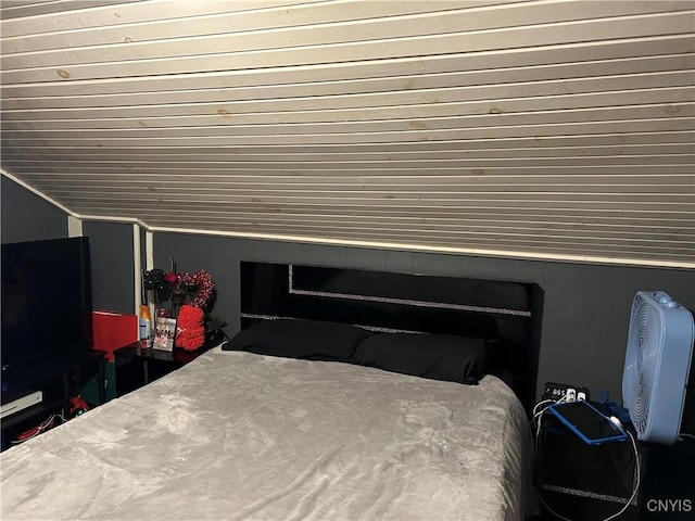 bedroom featuring lofted ceiling