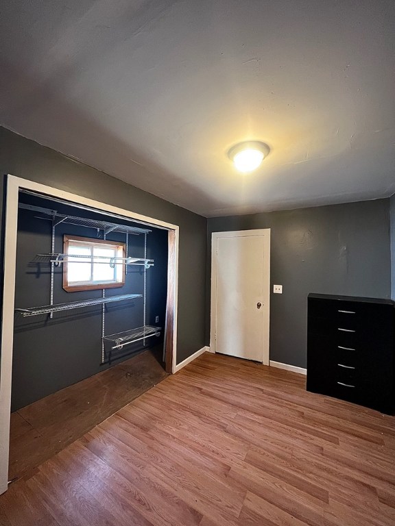 unfurnished bedroom featuring hardwood / wood-style floors