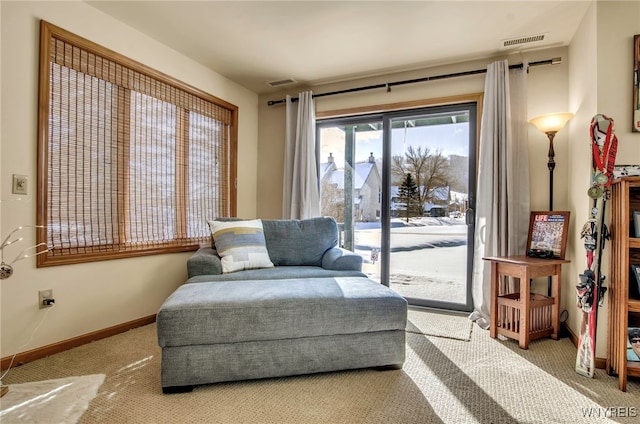 living area with light colored carpet