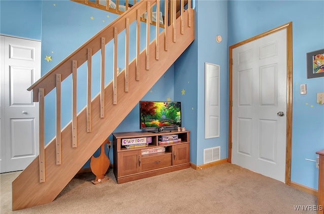 living room featuring light colored carpet